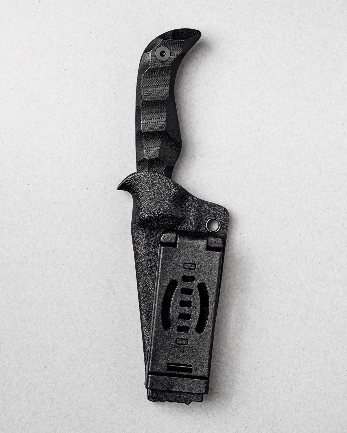 AUXMFG Karl Jr fixed blade, black G10 handle, 14C28N blade. Kydex sheath with clamshell clip, reverse side.